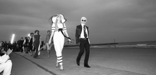 Karl Lagerfeld leads his models down a Venice boardwalk to present Chanel Cruise 2009