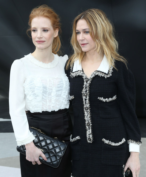 Jessica Chastain carrying a Chanel flap bag at the Chanel Fall 2013 show