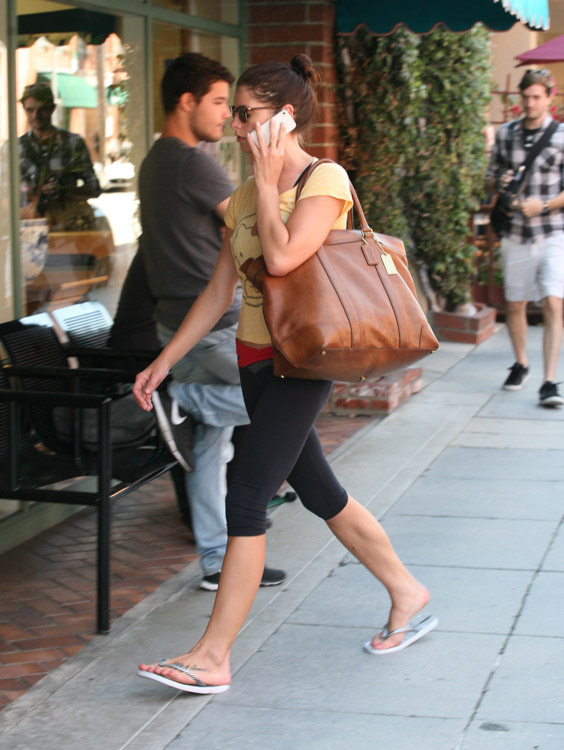 Ashley Greene carries a Coach Bleecker Legacy Weekend Tote (1)