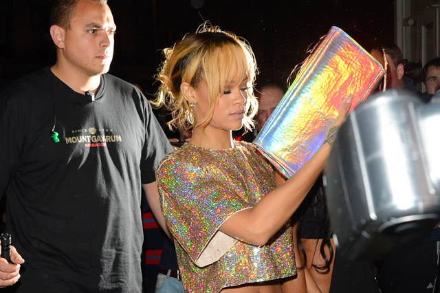Rihanna carries a Stella McCartney Holographic Clutch in London. (1)