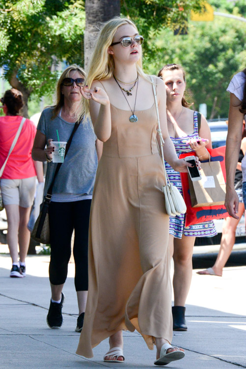 Elle Fanning carries an ivory Celine Trio Bag (2)