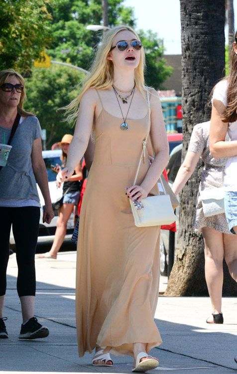 Elle Fanning carries an ivory Celine Trio Bag (3)