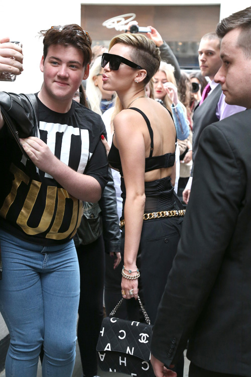 Miley Cyrus carries a Chanel bag in London (2)