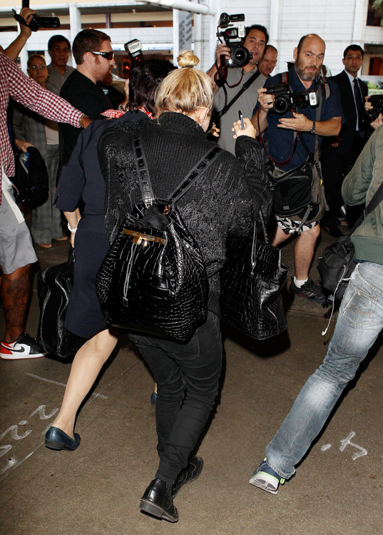 Mary-Kate Olsen carries The Row's Alligator Backpack and The Row's Carry All Tote in Alligator (2)