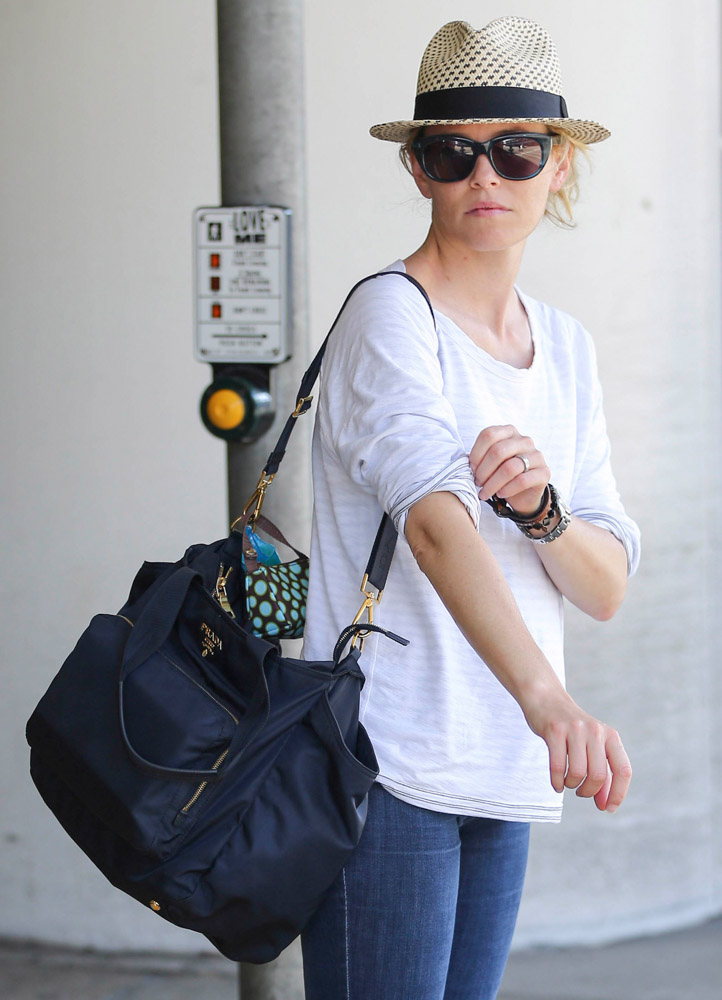 ParallaxShops woven wicker bucket bag Neutrals 50 Celebrities and the Bags They Carried to Fly out of LAX This Summer