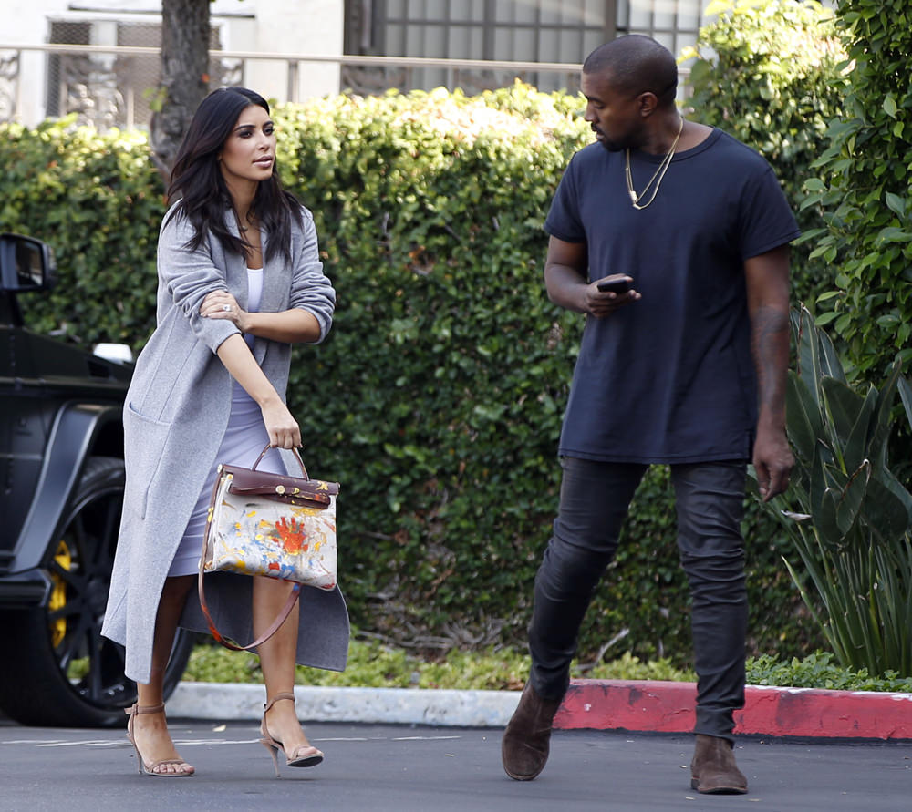 Kim Kardashian and Kanye West head to an office building in Los Angeles, CA