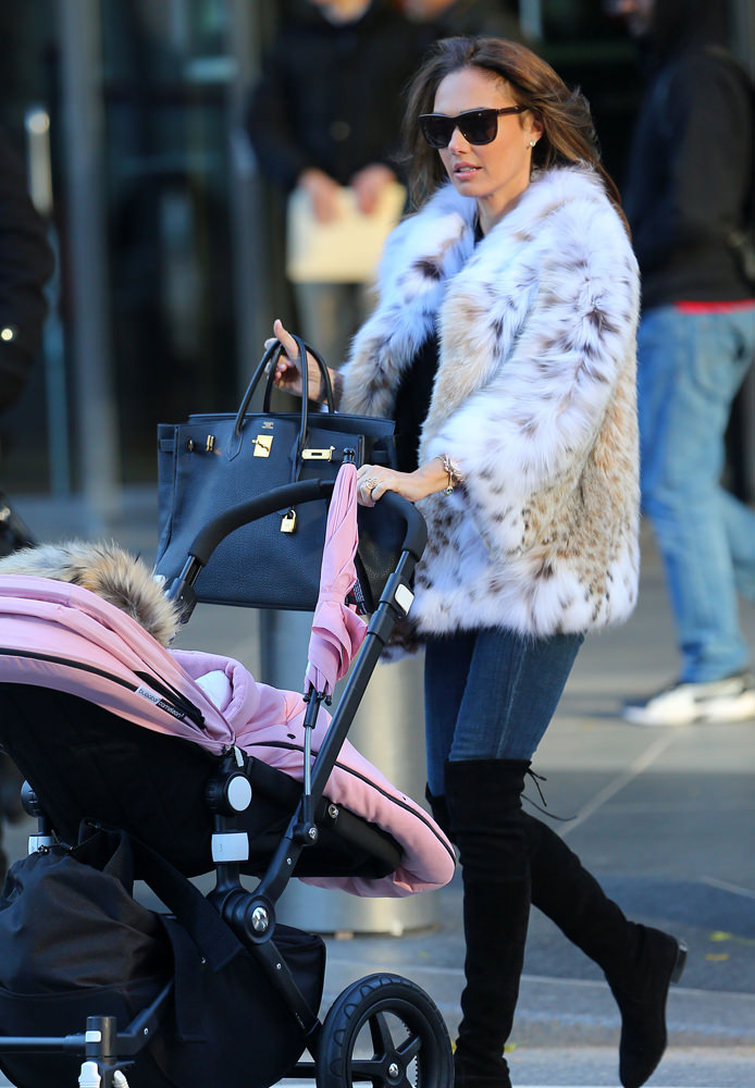 Jay Rutland and Tamara Ecclestone take a walk in Central Park with baby Sophia in a stroller in NYC