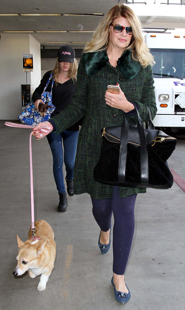 Actress Kirstie Alley is spotted with her dogs as she arrives at LAX Airport in Los Angeles