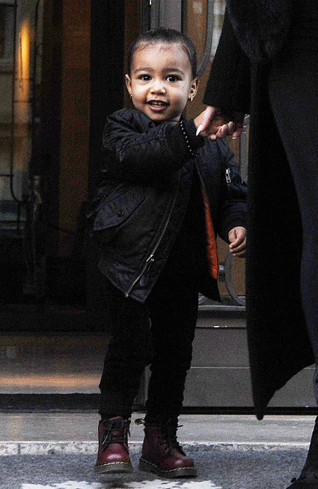 Kim Kardashian and her daughter North West leaving their hotel in Paris