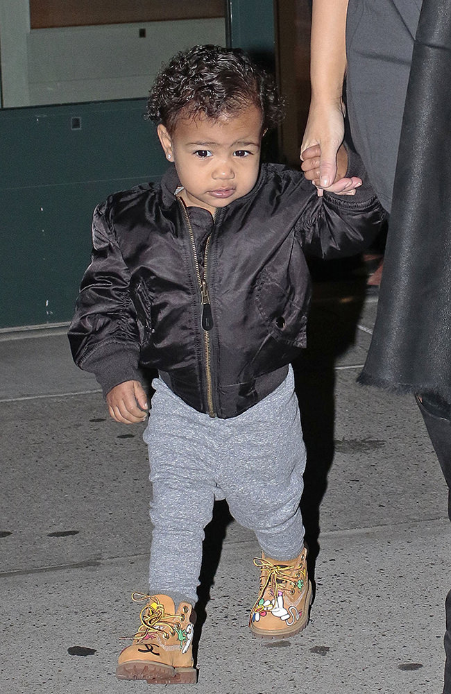 Kim Kardashian walks baby North West outside their apartment in New York City