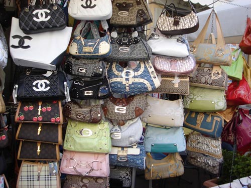 MIT says that you better look rich or your bag will look fake - PurseBlog