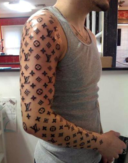 Fill in the blank: This LV tattoo is… - PurseBlog