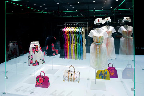 A visitor looks at handbags on display during the Louis Vuitton Voyages  exhibition at the National Museum of China in Beijing, China, 31 May 2011.  A Stock Photo - Alamy