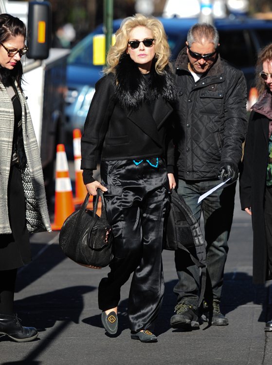 Sharon Stone carrying a GUCCI with the Classic signature logo