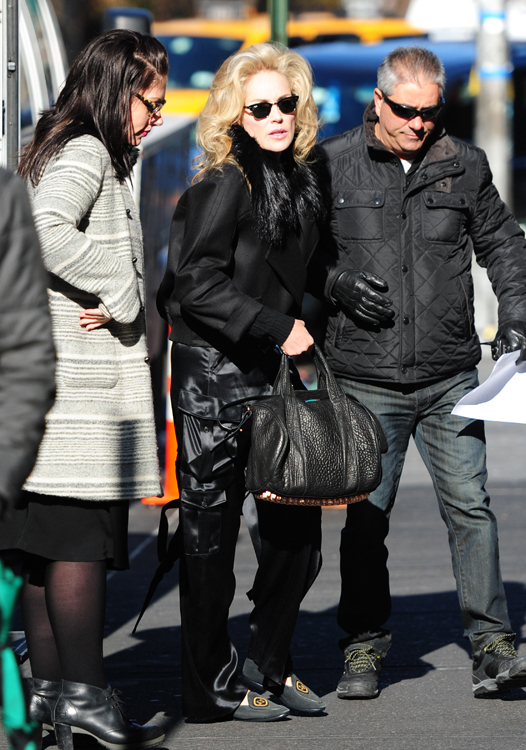 Sharon Stone carrying a GUCCI with the Classic signature logo