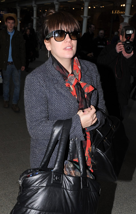 Lily Allen doubles up with Chanel and Saint Laurent bags at the