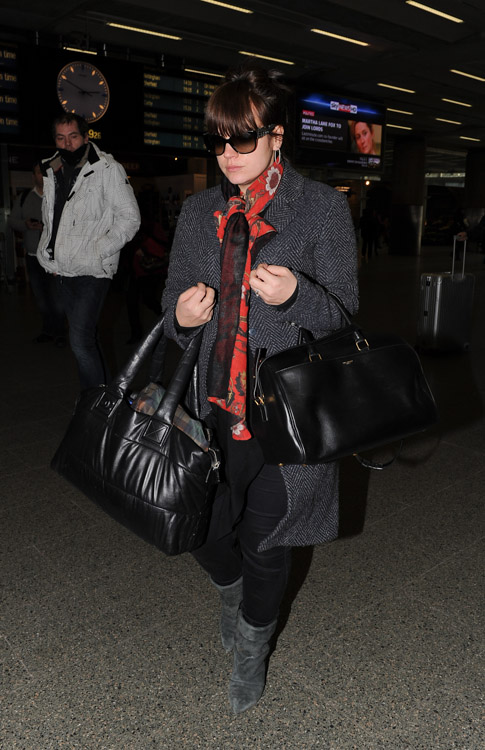 Lily Allen doubles up with Chanel and Saint Laurent bags at the