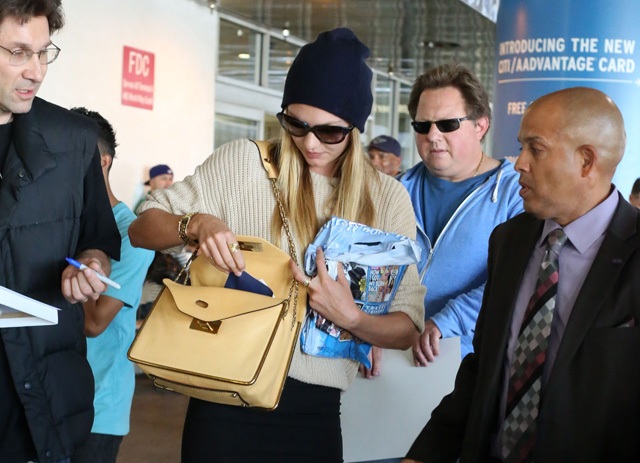 Candice Swanepoel carries a beige Chloe Sally Bag at LAX (5)