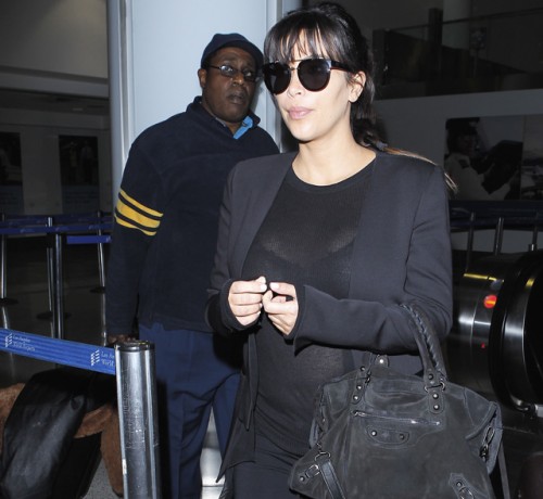 Kim Kardashian carries a black suede Balenciaga City Bag at the airport in Los Angeles. (5)