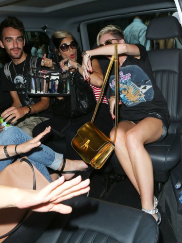 Miley Cyrus carries a gold Celine Classic Box Bag in London (1)