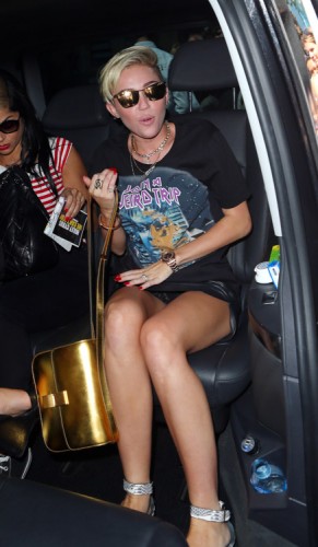 Miley Cyrus carries a gold Celine Classic Box Bag in London (2)