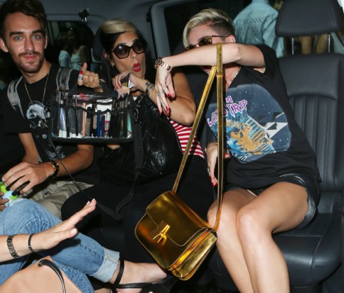 Miley Cyrus carries a gold Celine Classic Box Bag in London (5)