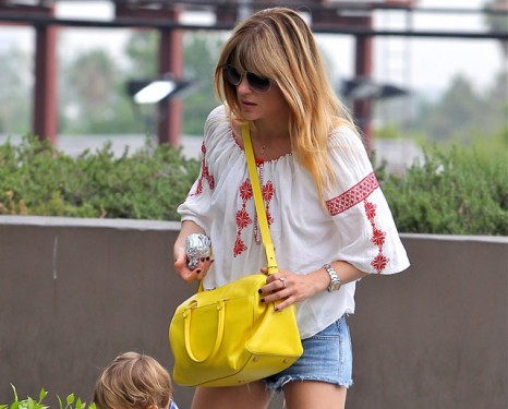 Selma Blair carries a yellow Saint Laurent Classic Duffel Bag (5)