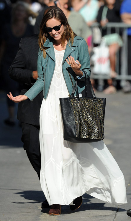 Olivia Wilde Supports Her Fiancé While Carrying a Christian