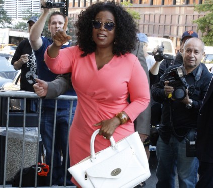 Oprah Winfrey carries a white Prada Spring 2026 Adds a Touch of Contemporary Edge to the Classic Prada Uniform in NYC (5)