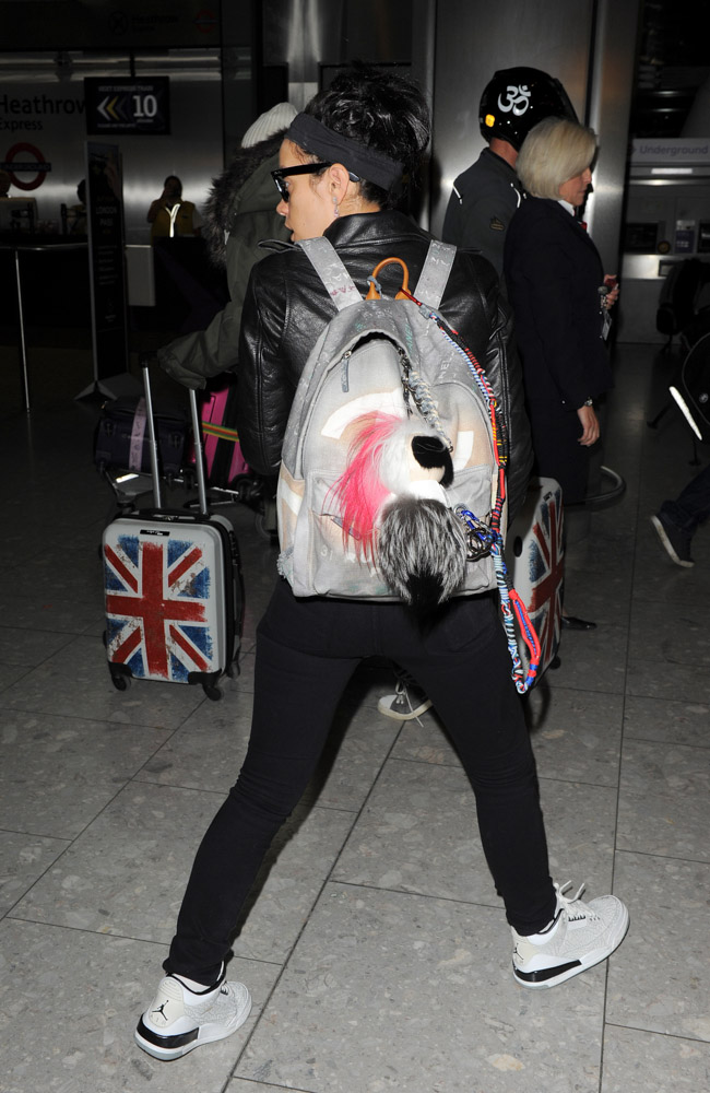 Lily Allen Returns to London with Chanel's Graffiti Backpack - PurseBlog