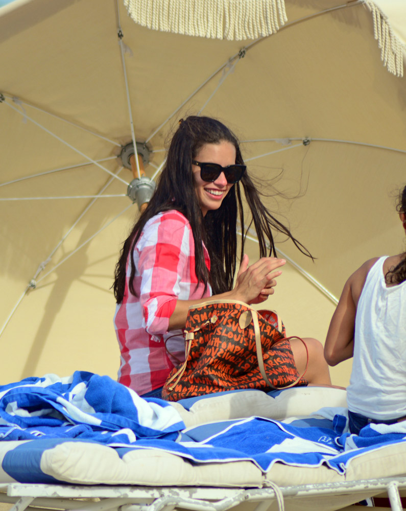 Adriana Lima Takes Her Louis Vuitton Bag to the Beach - PurseBlog