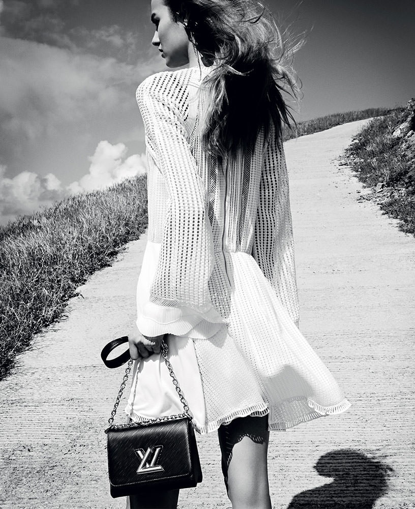 Woman Poses for Photographers with Black and White Louis Vuitton Bag and Adidas  Shoes before Emporio Armani Editorial Stock Image - Image of poses,  february: 195191534