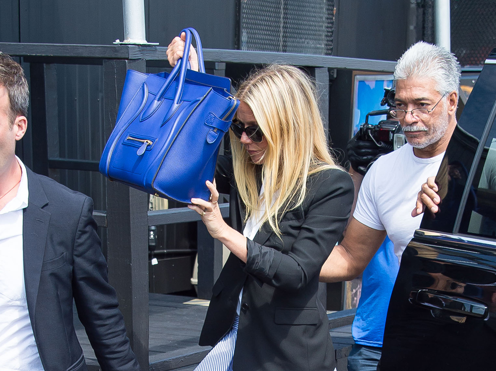 A Visual History of Celebrities Hiding Behind Their Handbags