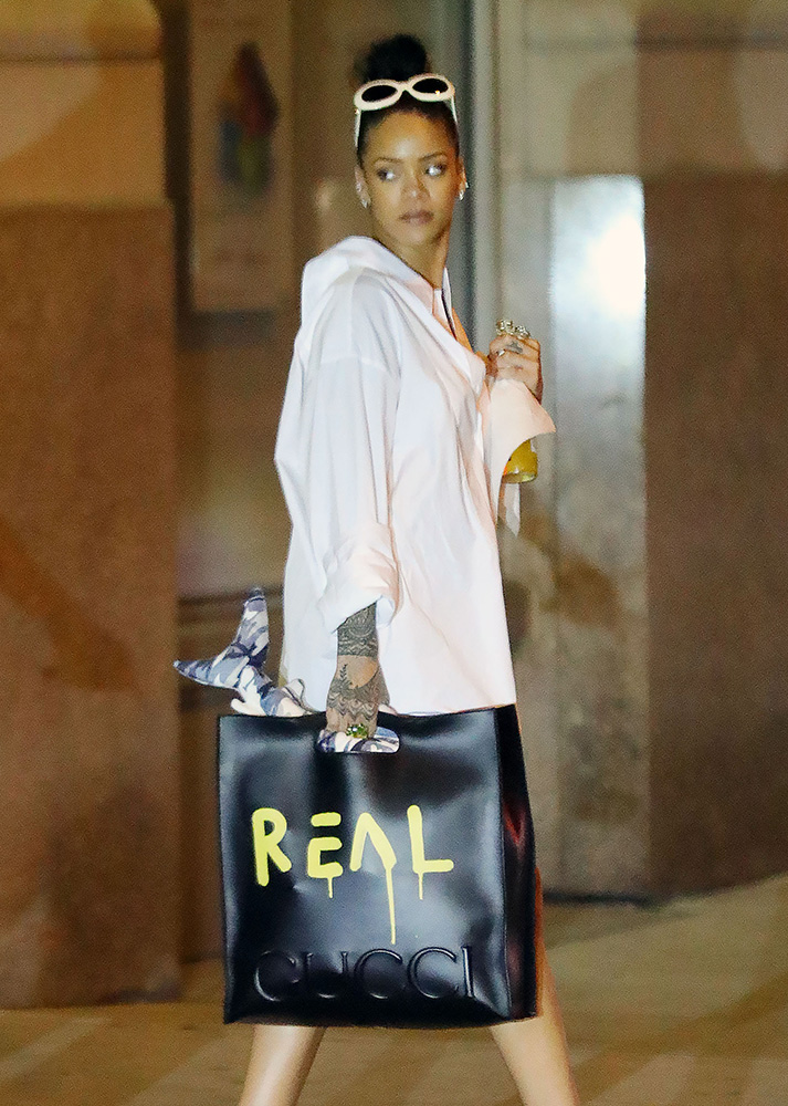 Rihanna carrying a Gucci USA GG Flag Collection Boston bag. Courtesy of  Pacific Coast News. www.gucci.com