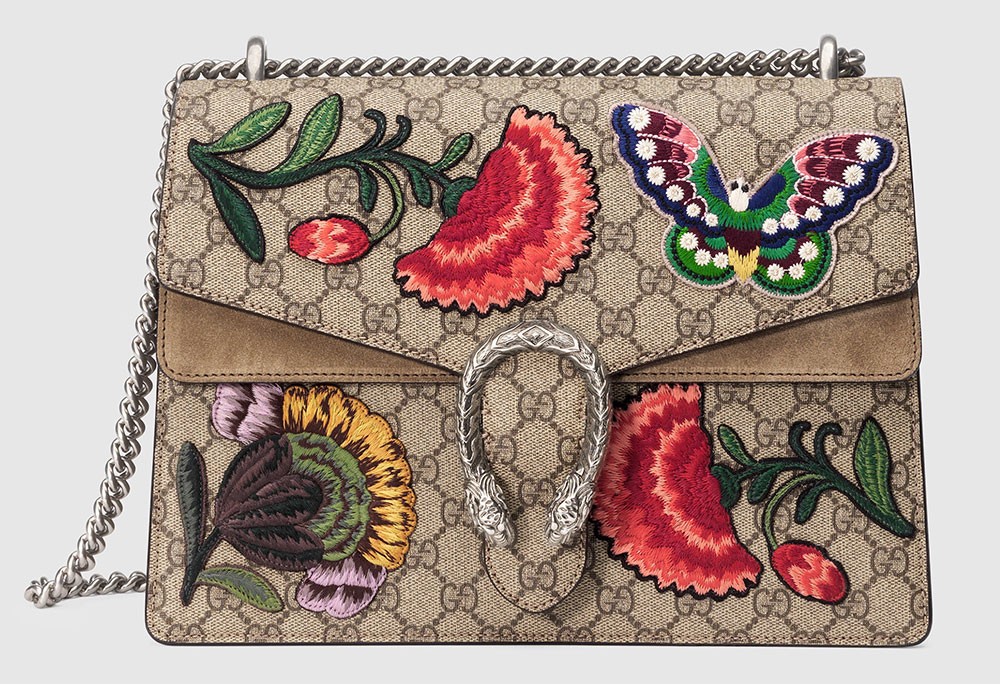 gucci purse with patches.