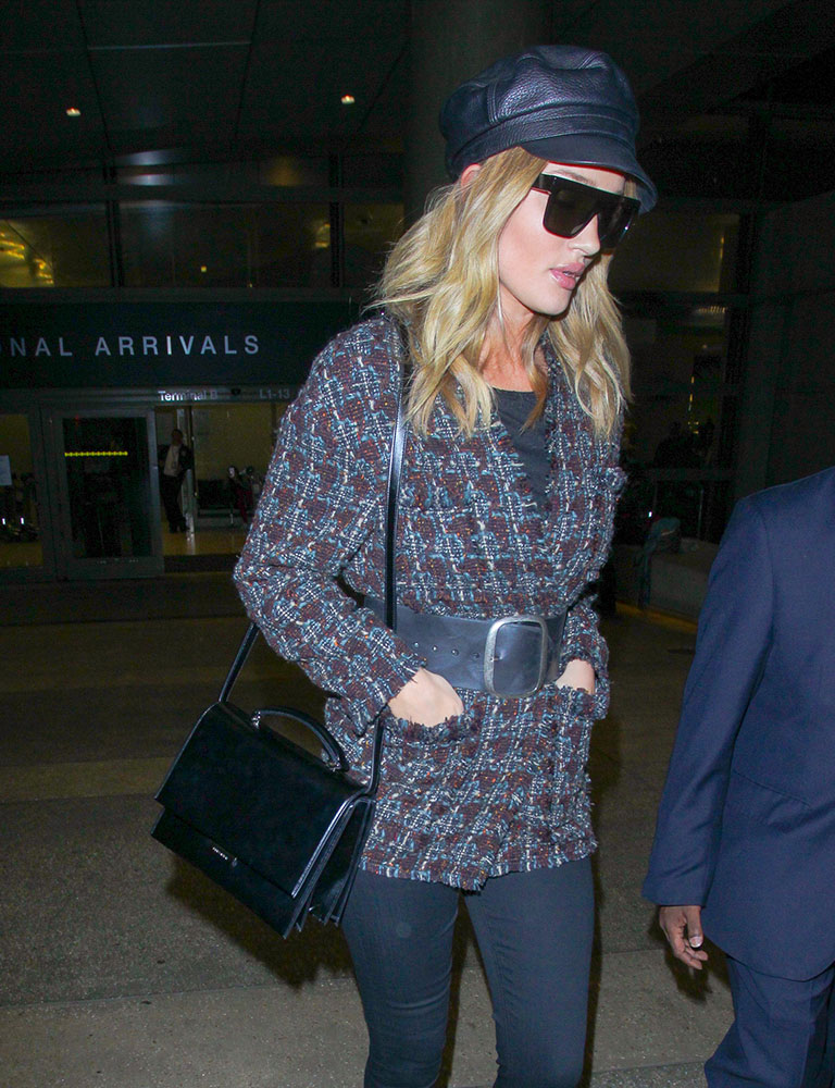 Rosie Huntington-Whiteley leaves the gym carrying a £3,200 Prada bag