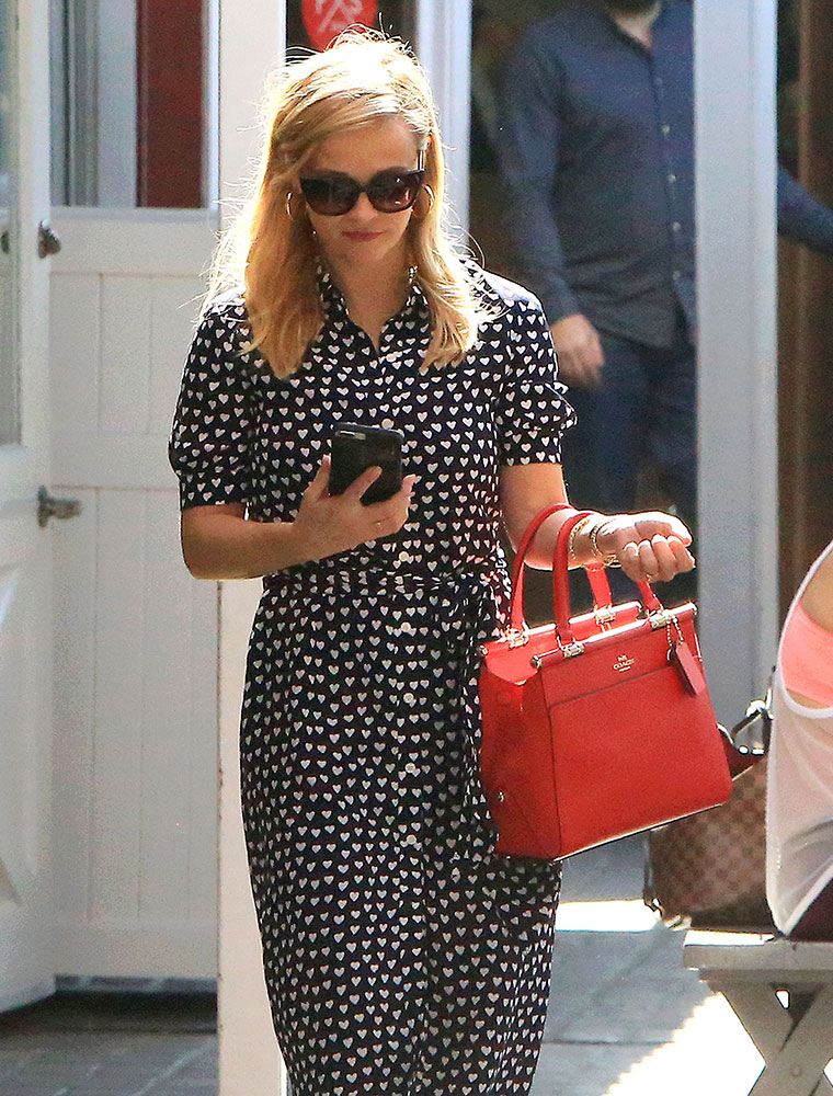 Reese Witherspoon sports a cheery red Louis Vuitton bag - PurseBlog