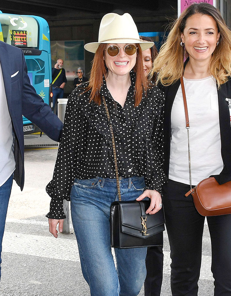Julianne Moore Wears Black Suit and Louis Vuitton Backpack at Las Vegas  Airport