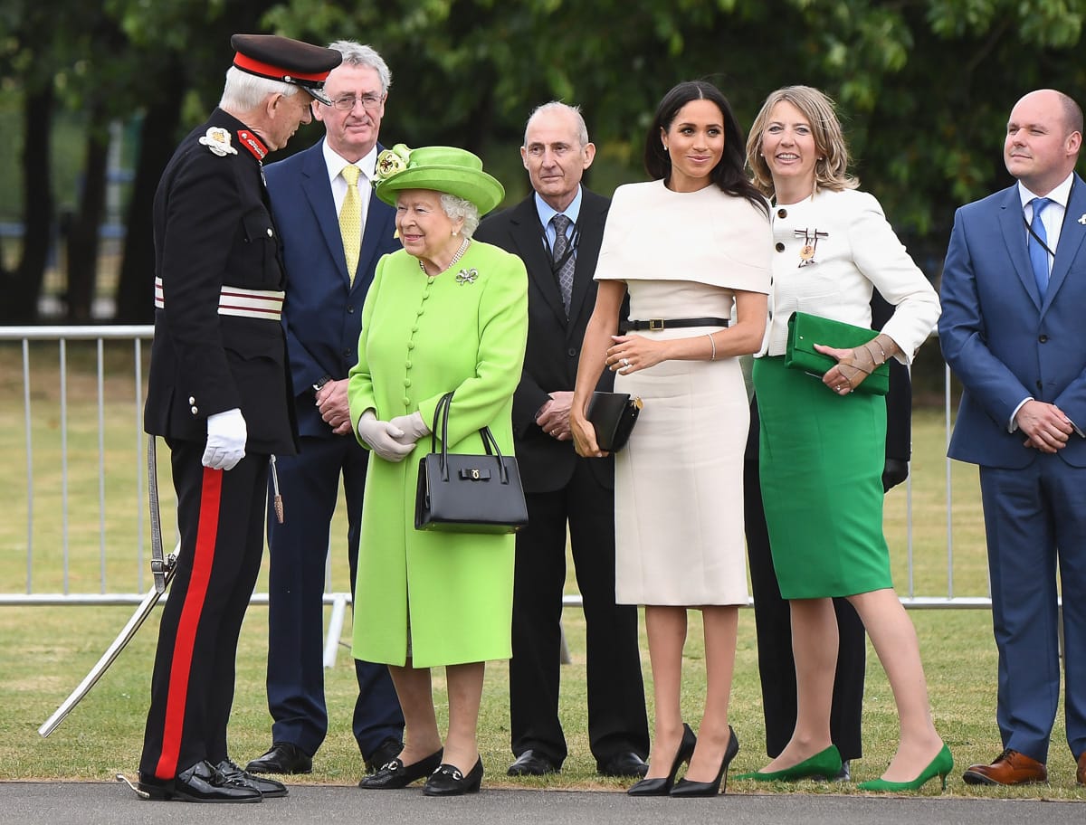 Meghan Markle with her Givenchy Cross3 Leather Crossbody Bag