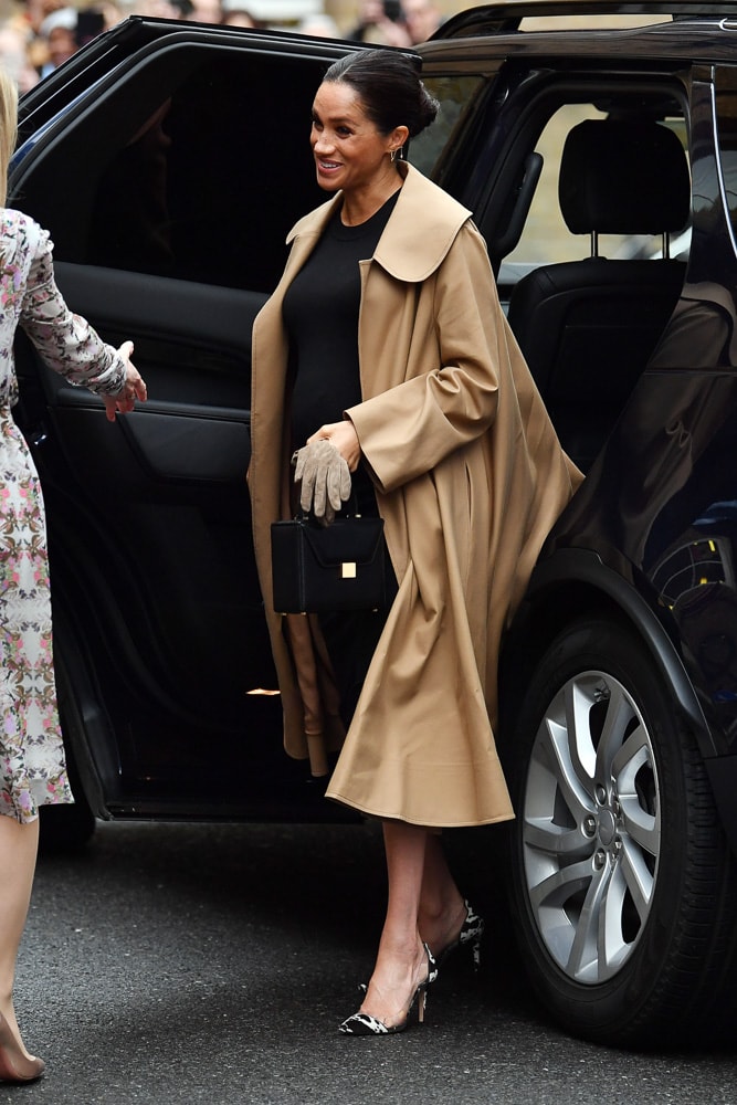 Meghan Markle with her Victoria Beckham Black Mini Vanity Bag