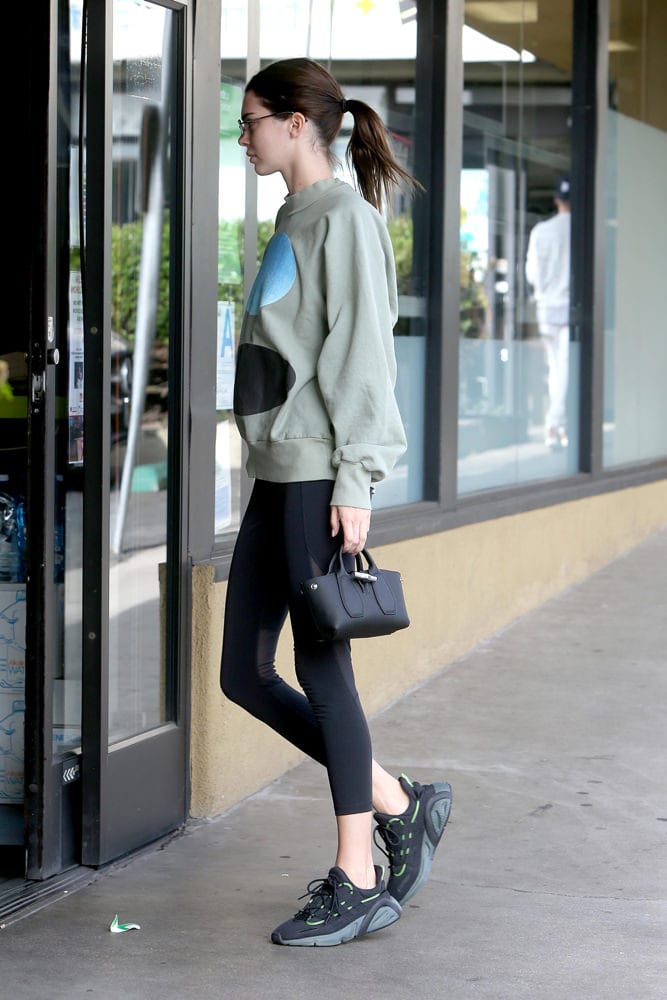 Bella Hadid carries her Louis Vuitton and Chanel bags as she steps out of  her apartment