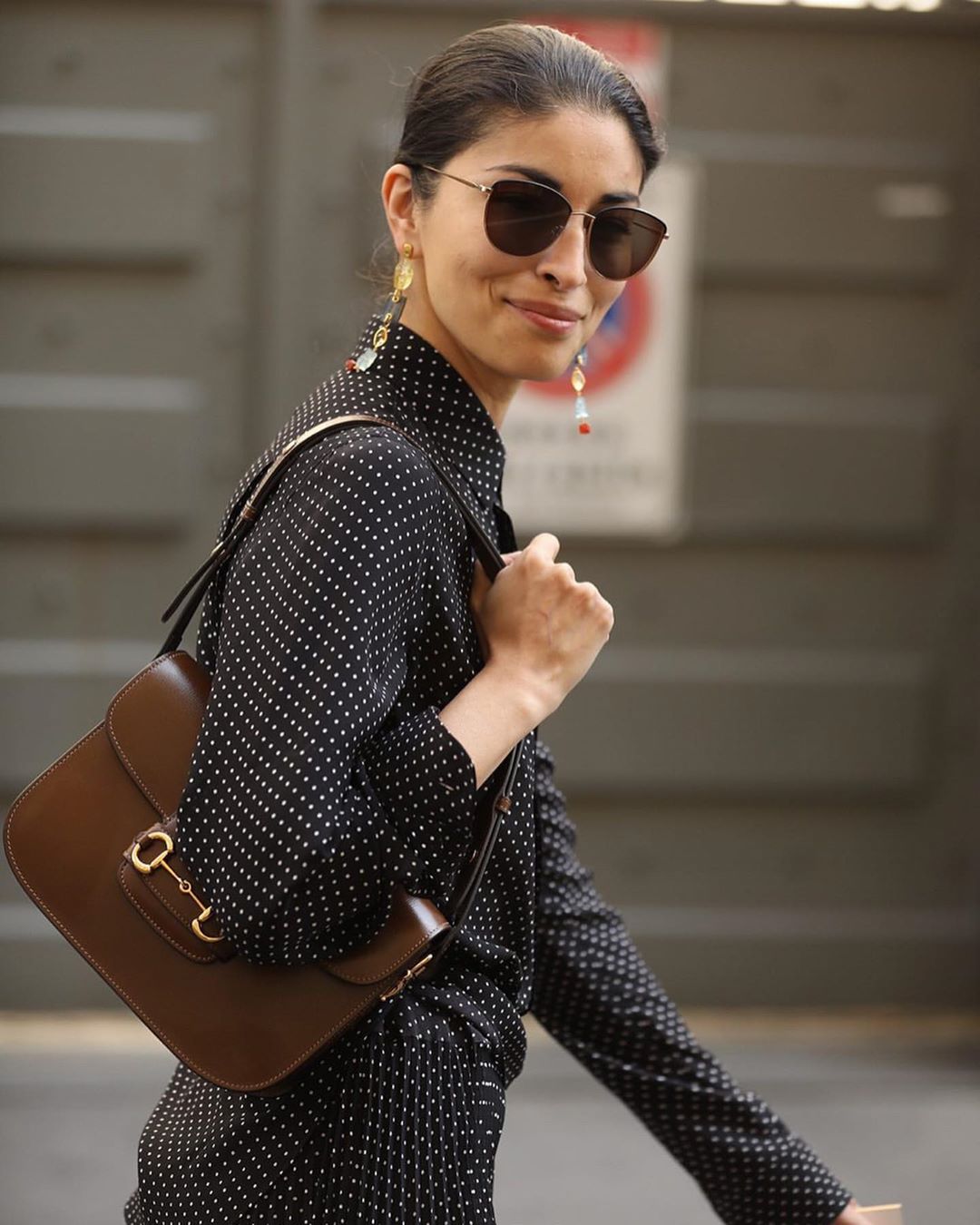 Benita Elmedia, @surgeofstyle on instagram wears Gucci 1955 horsebit bag  with jeans, alexander mcqueen trainers and black blazer. Shop …