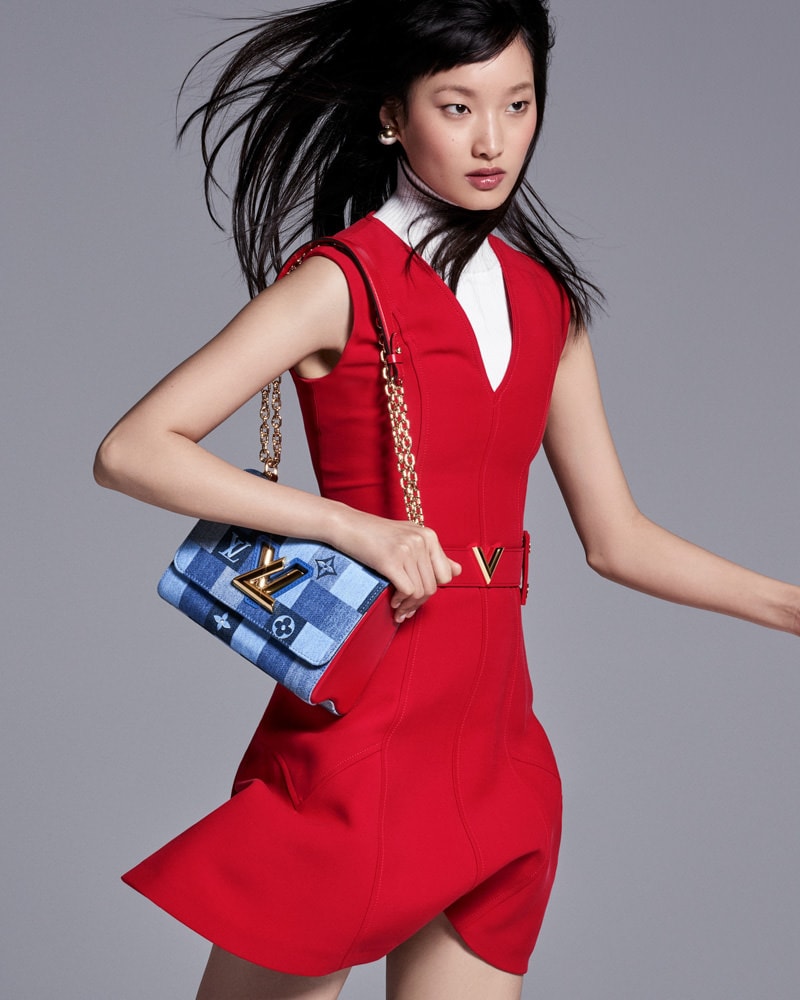 Asian Tourist Girl With A Louis Vuitton Shopping Bag On
