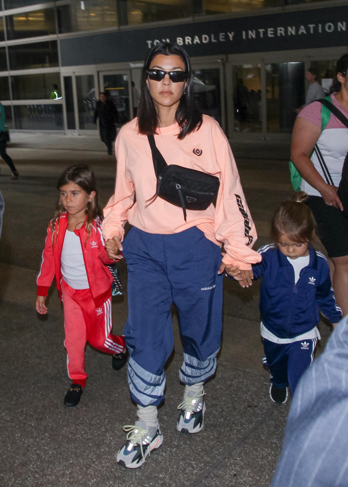 Kourtney Kardashian juggles Reign and $1,910 LV purse