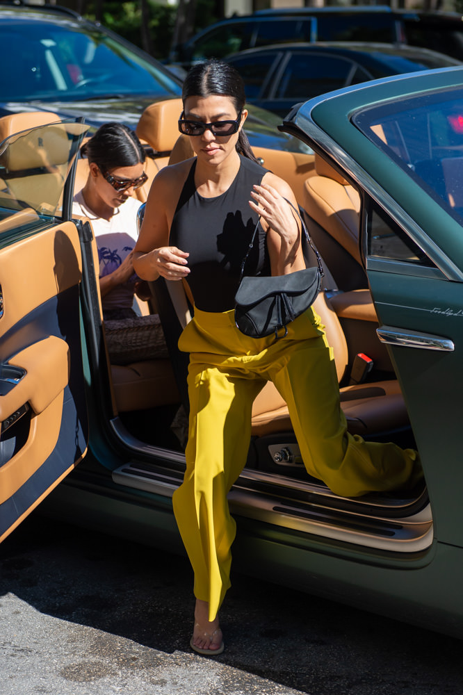 Kourtney Kardashian juggles Reign and $1,910 LV purse