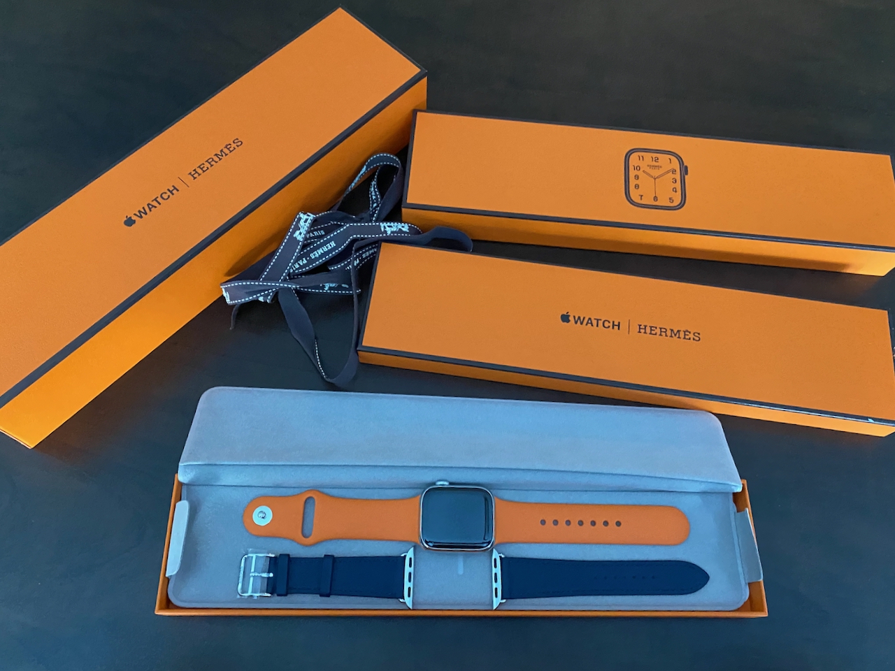 The Apple Watch Hermès comes with the Hermès-only orange sports strap, and then you also select a leather band. Photo via @The_Notorious_Pink