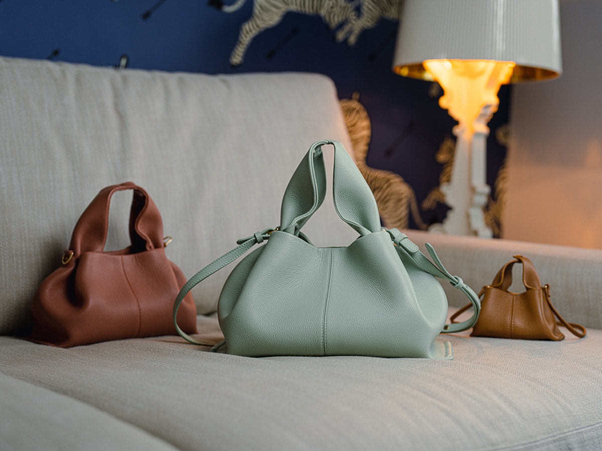 The Polene Neuf bag in Chalk (right) and Taupe (left) color are