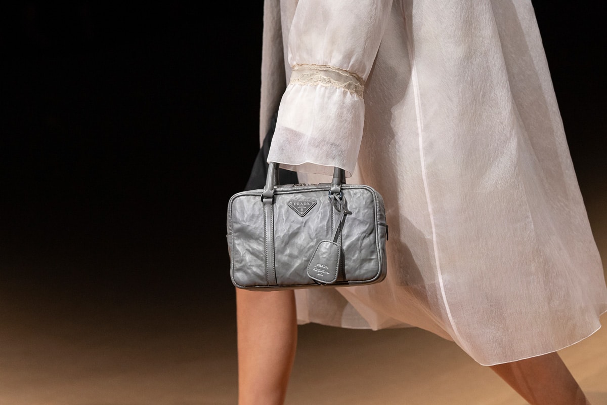 Prada Emblème brushed-leather Bag - Farfetch in 2023