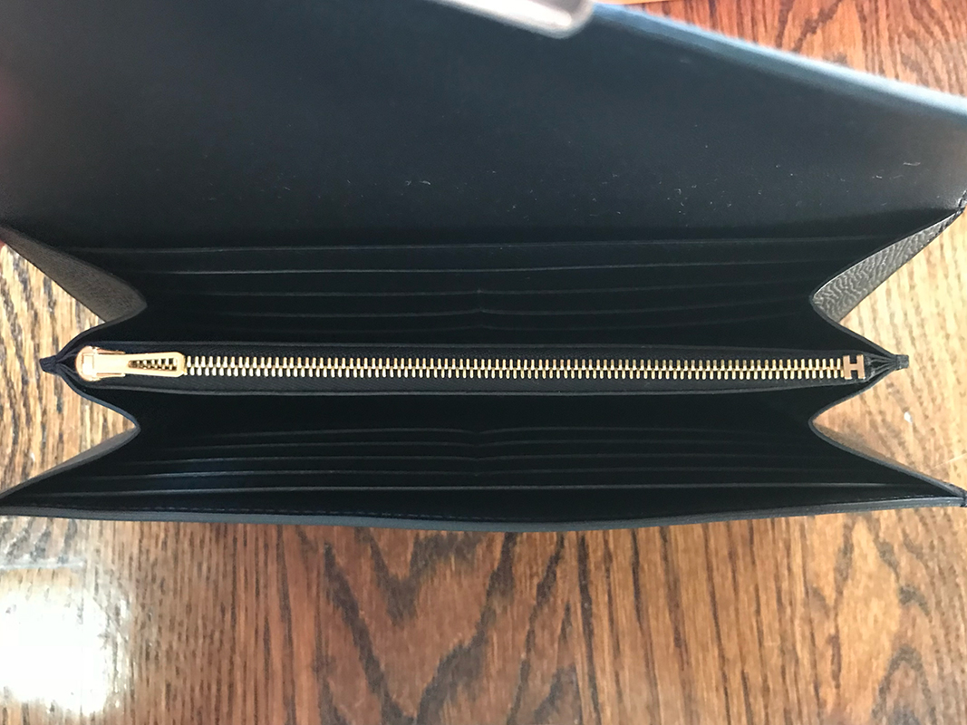 The interior of the Constance Wallet is the same as the Kelly Wallet: 2 pockets, 12 card slots, zippered center section with Cadena zip closure. Photo via @The_Notorious_Pink.