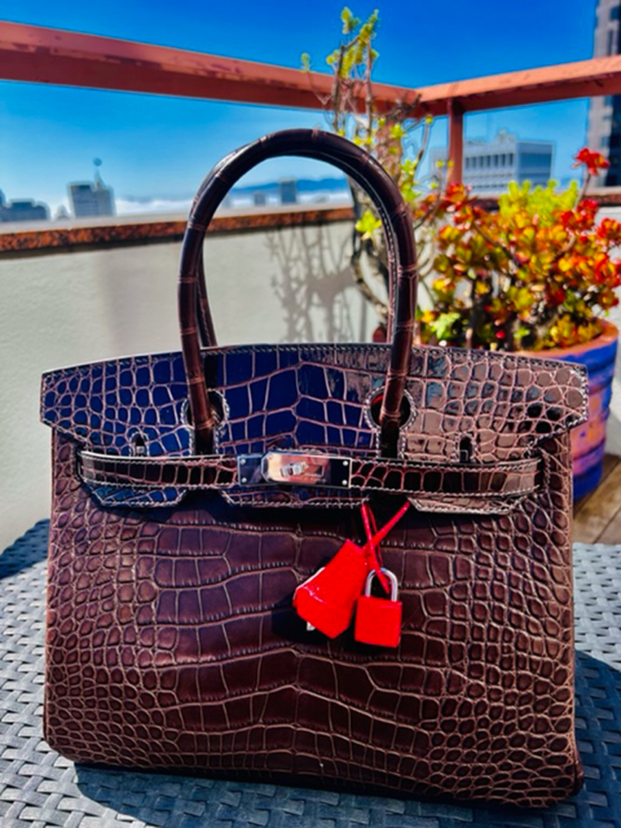 A 30cm Birkin made with Macassar Shiny Gator (Flap); Ebene Matte Gator (Body); and Rose Extreme Interior, Lock and Clochette from May 2022. Photo via TPFer @spicybison.